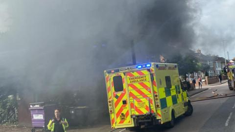 An ambulance at the scene of a fire in Kempston