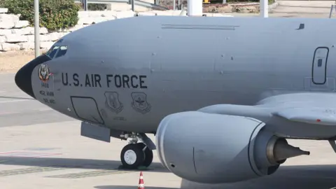 A US Air Force Boeing KC-135 Stratotanker aerial refuelling tanker aircraft is seen at an airport.