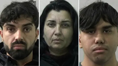 NEROCU Mugshots of Giacomo Nikolov, Jela Jovanoic and her son Charlie Jovanovic. Giacomo has long black hair and a black beard, Jela has thick long black hair and Charlie has a long black fringe and a faint moustache