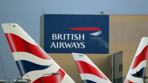 Hannah McKay British Airways logos are seen on tail fins at Heathrow Airport