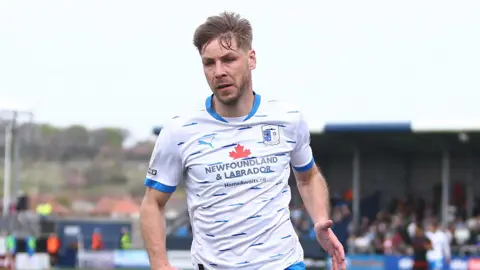 Sam Foley playing for Barrow