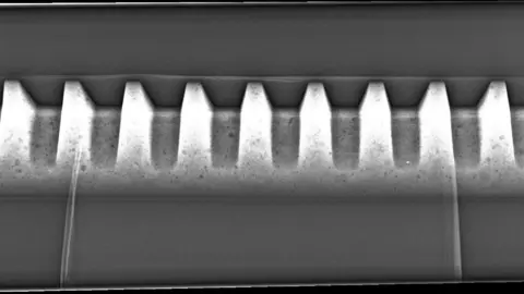 Contributed A Toblerone chocolate bar is pictured as an x-ray image in black and white.