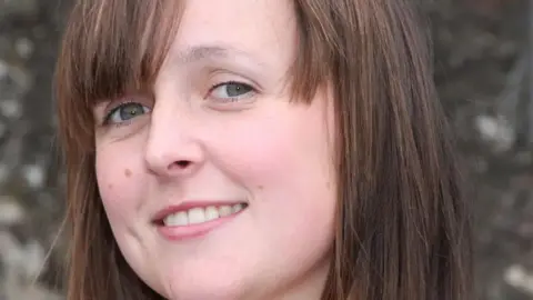 Stephen McClay A close-up shot of Sarah McClay who was a keeper who died at South Lakes in 2013. She has brown hair in a 'bob' cut and is smiling at the camera.