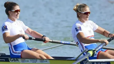 Getty Images Frankie Allen (left) and crew-mate Giedre Rakauskaite rowing on a boat.