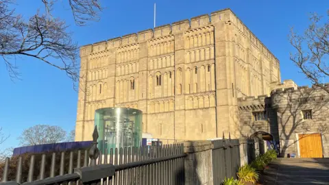 Shaun Whitmore/BBC The outside of Norwich Castle in Norwich city centre on a sunny day, with blue sky above.
