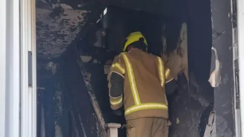 Amanda Harrison Fire damaged house