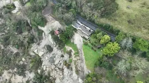 Isle of Wight Council A stretch of Leeson Road beside a house that sits right next to a cliff where a landslide has recently taken place. 