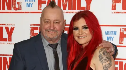 Getty Images Ricky Knight and Saraya Knight attend the UK Premiere of Fighting With My Family at BFI Southbank in London in 2019. Ricky has a mohican, while Saraya has long red hair.