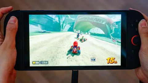 Getty Images A person playing Mario Kart World on a Switch 2 console