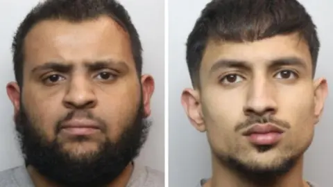 A composite of two mugshots, with, on the left, a man with black hair and a black beard and in the photo on the right, a man with black hair and a moustache and goatee beard.