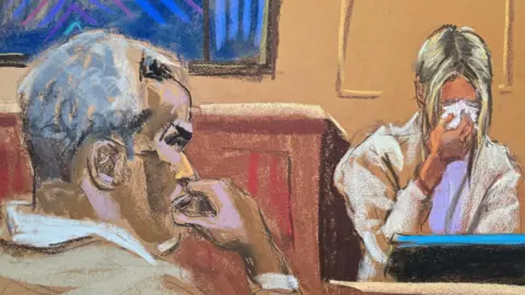 Sean "Diddy" Combs watches as witness "Mia" testifies in Combs' sex trafficking trial in New York City