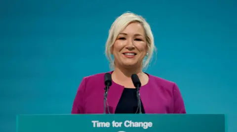 Reuters/Clodagh Kilcoyne Michelle O'Neill smiling as she addresses delegates to Sinn Féin ard fheis in Athlone