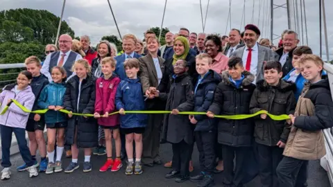 Transport Nottingham Schoolchildren from William Booth Primary and Lady Bay Primary - two nearby schools on either side of the bridge - helped cut the ribbon with Nottingham City Council Leader Neghat Khan.