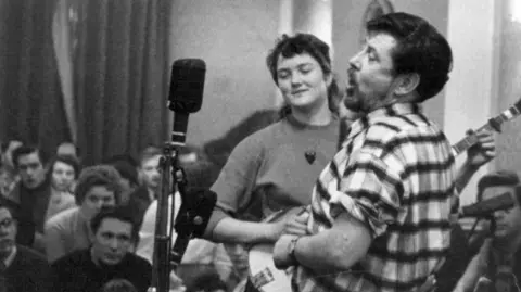 Heritage Images/Getty Peggy Seeger and Ewan MacColl performing at Enterprise Public House, Long Acre, London, late 1950s-early 1960s. Folk club session. 