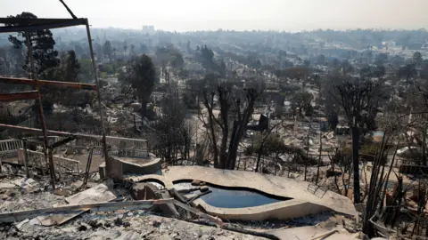 Reuters Debris from burned properties following the Palisades Fire 