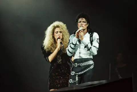Getty Images Sheryl Crow performs with Michael Jackson at Wembley Stadium in 1988