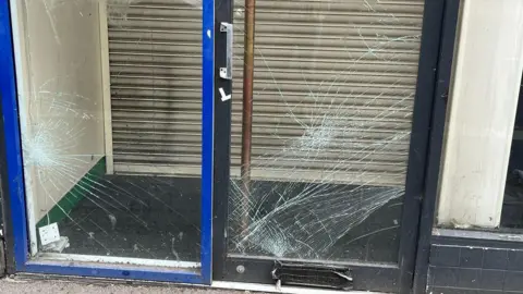 Two glass doors smashed.