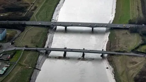 Aerial view of two road bridge over the river Great Ouse. 