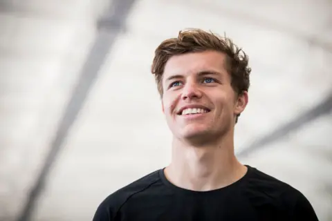 Getty Images Footballer Callan Elliot smiling in a black top 