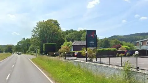 Google A sign for Red Chilli along the A24
