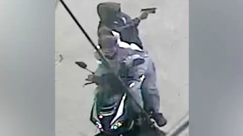 CCTV footage of the two suspects on a moped.