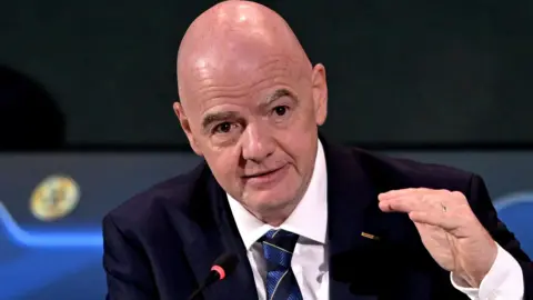 Gianni Infantino gesticulates at the Fifa congress in Paraguay 