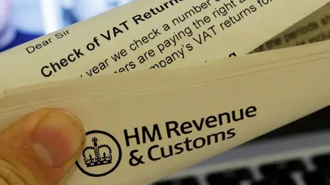 An image of a HMRC letter in front of a computer