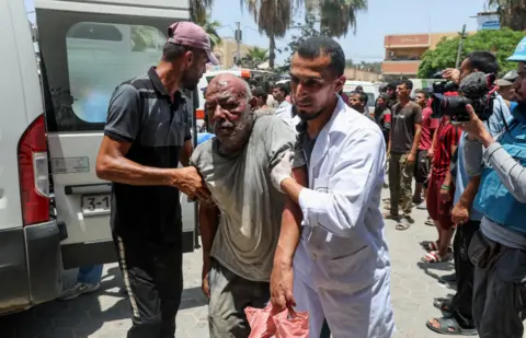 Reuters  Palestinian man is assisted in the aftermath of an Israeli strike, amid the Israel-Hamas conflict, at Al-Aqsa Martyrs Hospital in Deir Al-Balah