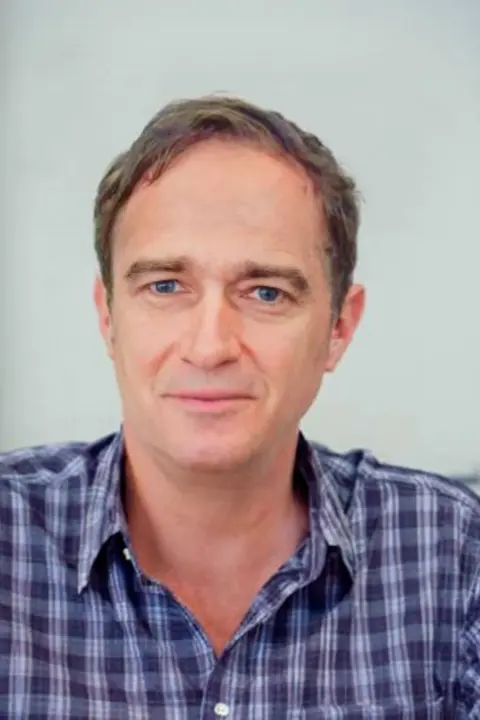 Police Scotland An e-fit image from the police, showing a man with short dark hair in his 50s.