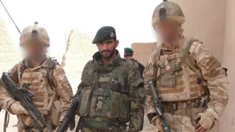 Supplied Former Afghan National Army officer Sardar on patrol with British forces