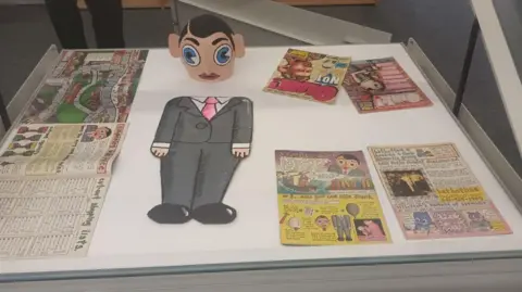 LDRS Selection of rare artworks on display at an exhibition on cult comic figure Frank Sidebottom.