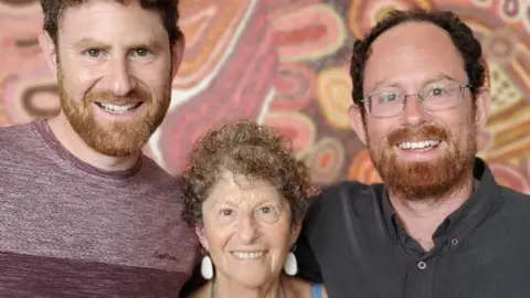 Professor Felicia Huppert (centre), who was the mother of Rowan (left) and Julian (right), chose to use assisted dying law in New South Wales in Australia