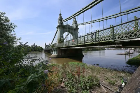Anadolu via Getty Images A general view of the River Thames, where water levels have dropped due to prevailing hot and dry weather conditions in London, United Kingdom, on July 24, 2026.