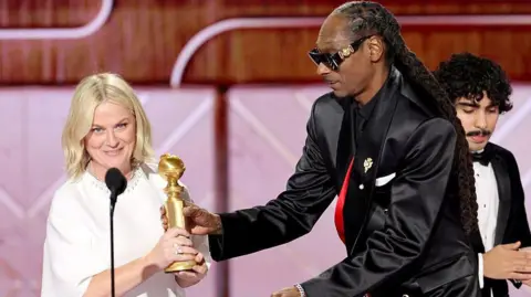 CBS via Getty Images Amy Poehler and Snoop Dogg