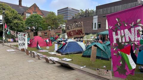 The anti-Gaza war encampment at Newcastle University with banners strung up amid tents