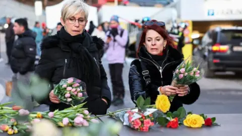 Reuters People leave flowers outside the "Le Constellation" bar