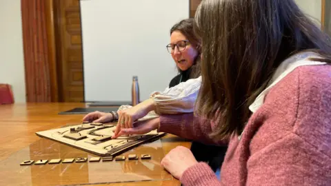 RNIB Bernie Reddington is shown a 3D model of a separate project