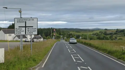 Google Traffic lights on a crossroads with a wide view of the countryside beyond