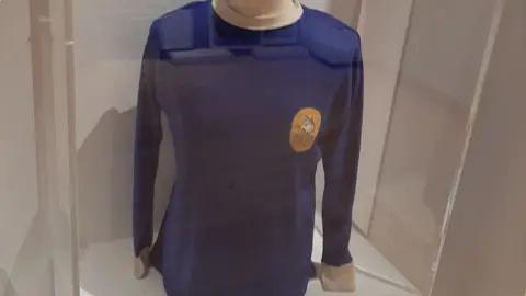 An old Carlisle United football top