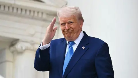 S President Donald Trump arrives to deliver remarks at the National Memorial Day Observance at the Memorial Amphitheatre in Arlington National Cemetery in Arlington, Virginia, on May 26, 2025. 