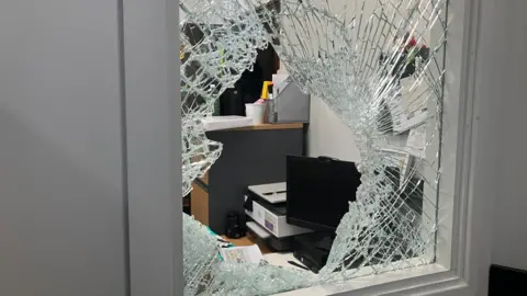 BBC / Elizabeth Baines A smashed window at a nursery school in Hipperholme near Halifax