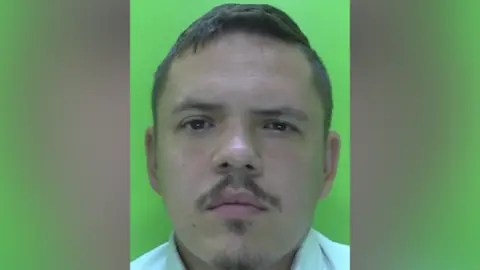 Nottinghamshire Police A police mugshot of a man with a goatee beard and moustache