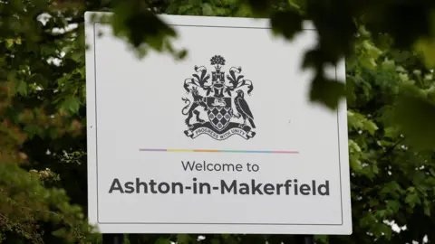 Reuters A large black and white "Welcome to Ashton-in-Makerfield" roadsign