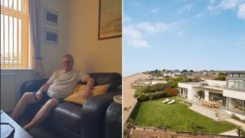 Omaze Composite image of a man sitting on a dark-coloured leather sofa next to an aerial view of a beachfront white-rendered property, with a seating area and sun loungers in the garden.