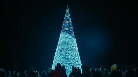 Tom Anders/Longleat A christmas tree lit up by lanterns