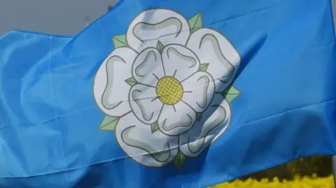 PA The Yorkshire Rose flag - the white rose of Yorkshire on a blue background