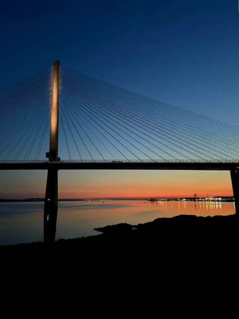 Erin Harper The Queensferry Crossing, a large suspension bridge, pictured at sunset 
