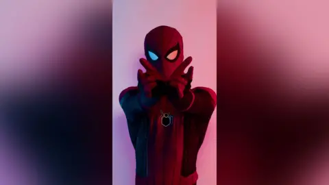 Supplied A man dressed up as Spiderman.