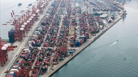 Getty Images Gantry cranes and shipping containers at the Chiwan container terminal in Shenzhen, China, on Friday, Feb. 27, 2026.