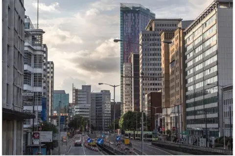 high rise buildings line a large road in Croydon with more tall blocks in the background
